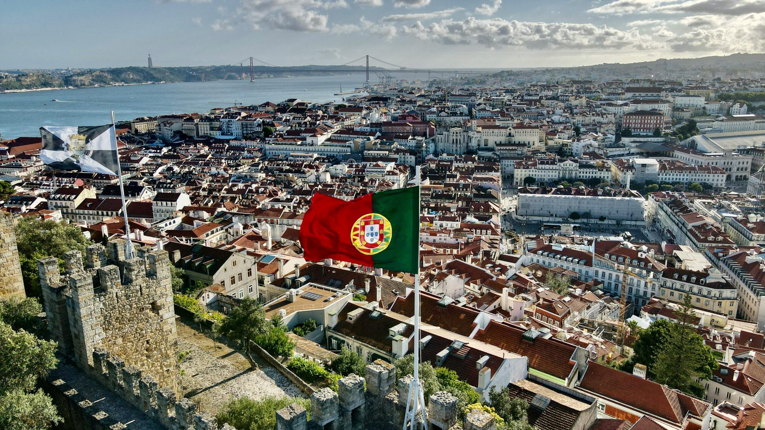 Stunning aerial view of Lisbon cityscape from Saint George's Castle on a sunny day.